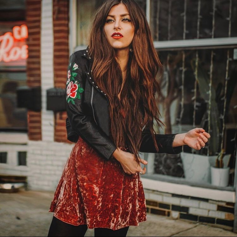 Rose and studded faux leather jacket
